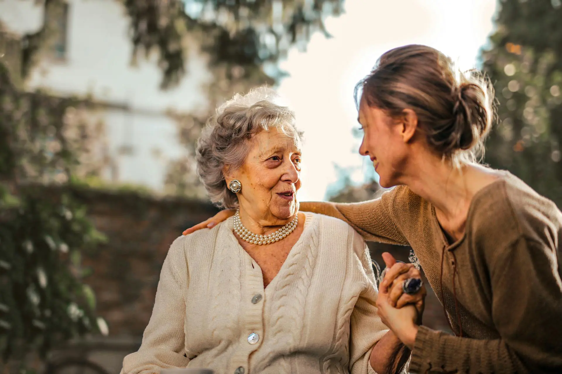 Elderly hands clasped together. California nursing home abuse and elder neglect attorneys