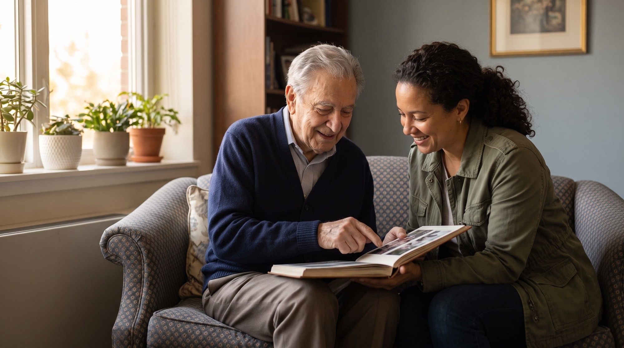 Elderly assisted living resident sharing a photo album with his daughter during a visit. Illustration for California Assisted Living Abuse Lawyers.