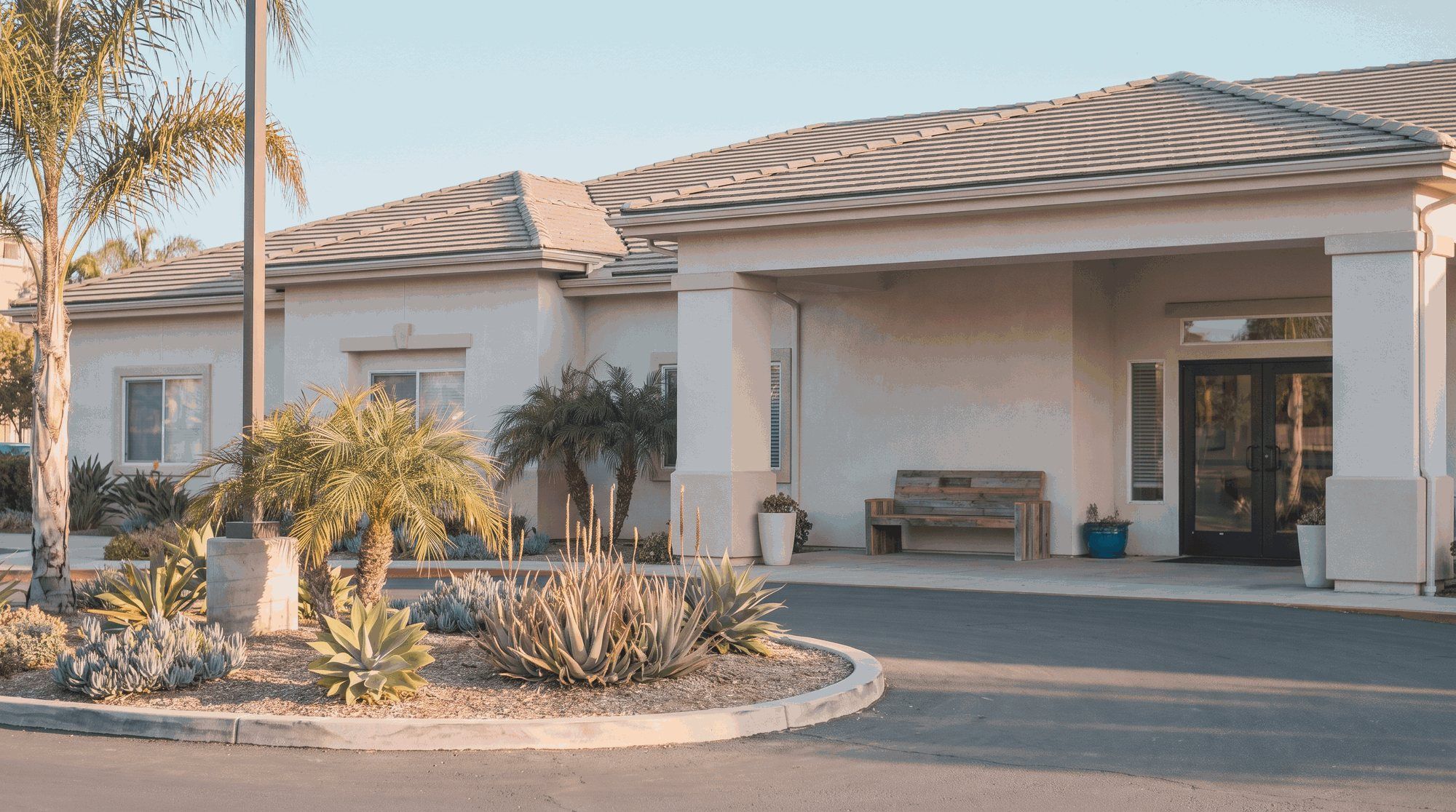 Entrance of a California skilled nursing facility on a clear morning. Illustration on the page for Arbor Post Acute in Chico, California.